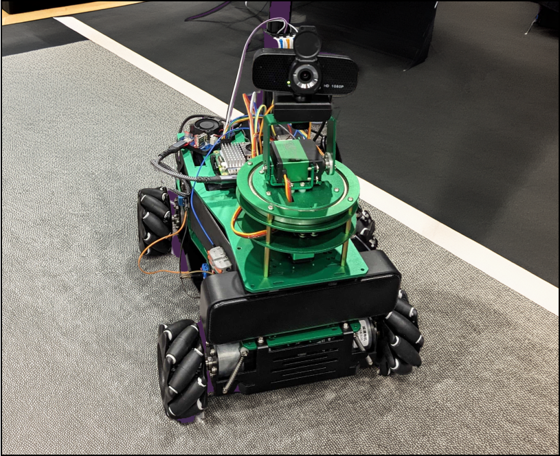 Combee, a robot with four wheels, green mounting plates, and sensors on top.